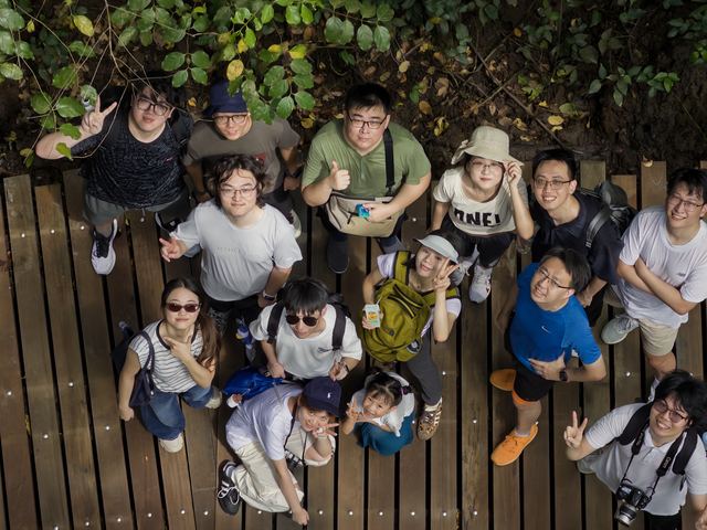 The team together on a wooden boardwalk on Pulau Ubin, Singapore